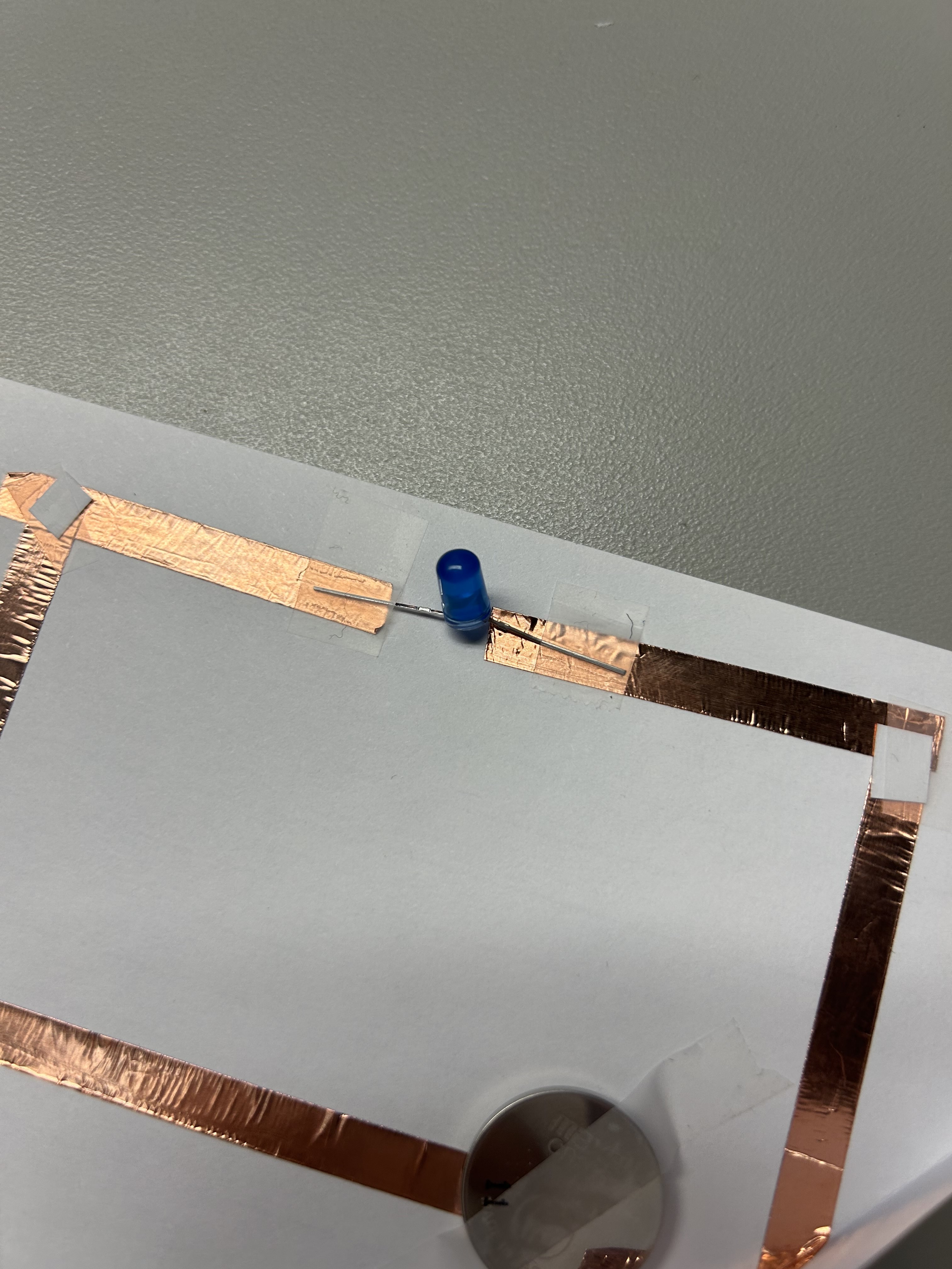 I got more feedback from my peers, and realized the light was flipped, and there was a shorter and longer end of the metal wire which indicated if it was negative or positive.