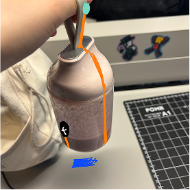 The other part of the conductive tape is on the table so when it's lifted up, it's no longer connected, and the light turns off.