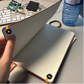 This is how it'll look inside the book with the battery and the connected conductive tape.