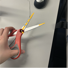This is the pair of scissors opened and the light turning off.