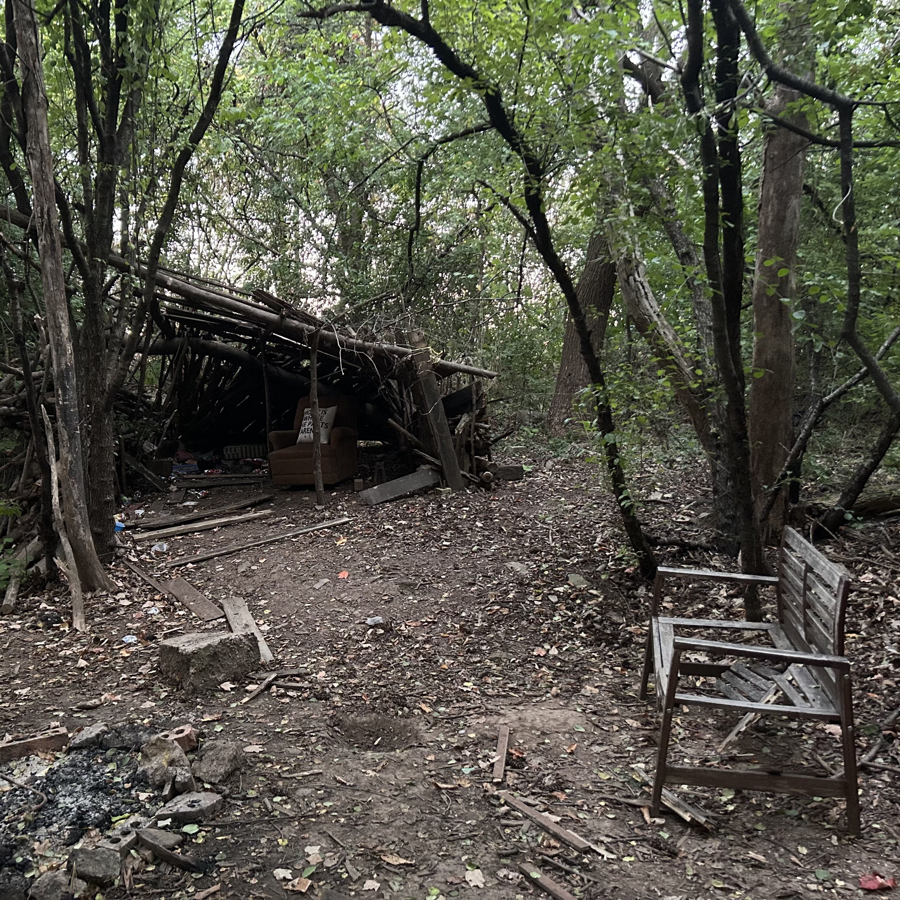 This is a space found in the trail behind Sheridan College, where people hangout, or shoot scenes. The structure is mostly made of wood, stones, different fabrics, and stuffing.