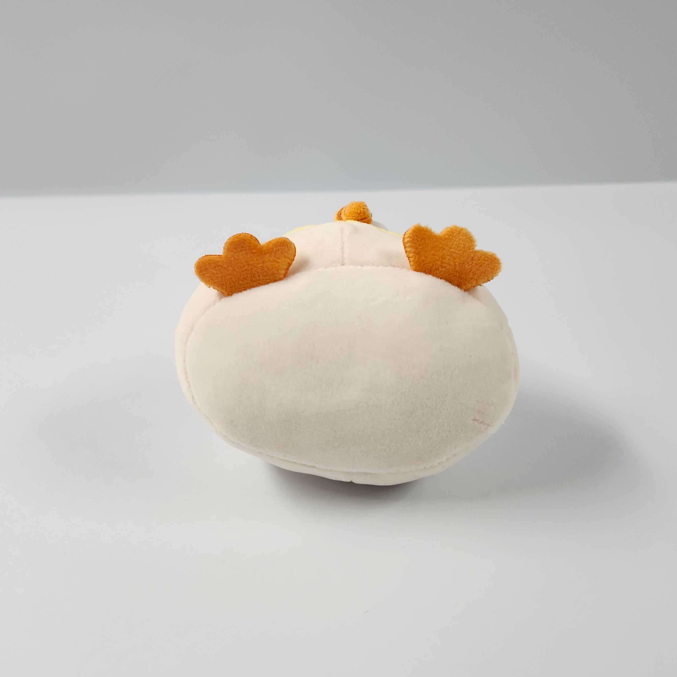 This is the bottom view of the mini plushie. From this view you can see the flat feet, and the beak that protrudes out.