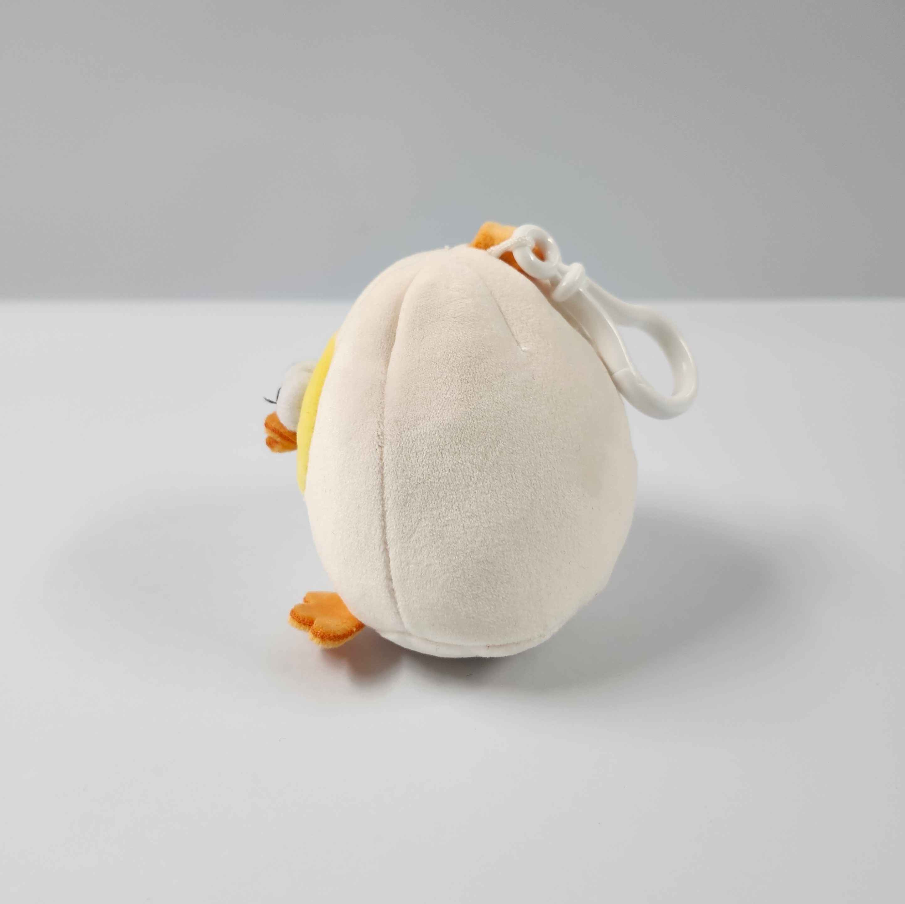 This is the side view of the mini plushie. From the side it looks more flat, and seems like the shape of an egg.